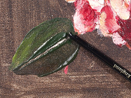 Scratching leaf veins with end of paint brush